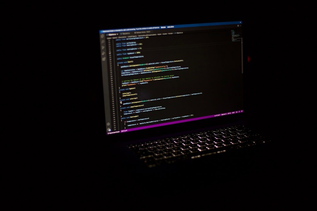 novice programmer coding on laptop