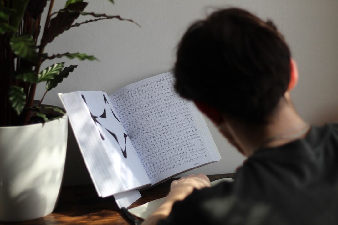 person studying programming books